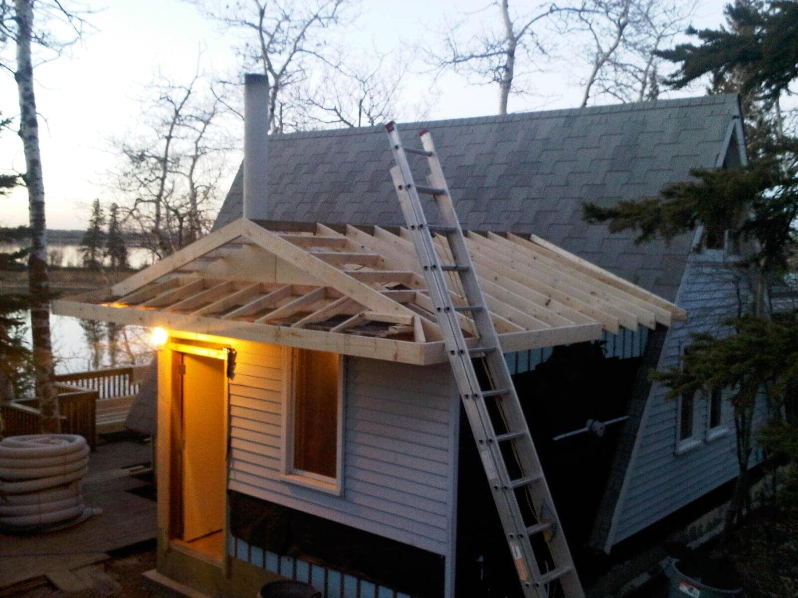 Cabin roof framing project by lake